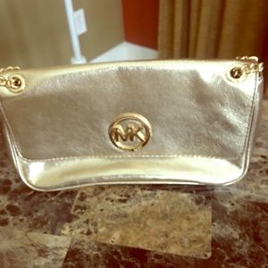 Michael Kors purse, and a cross body purse as well